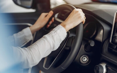 Stylish and elegant woman in a car salon